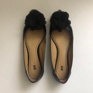 BP. Black leather flats.